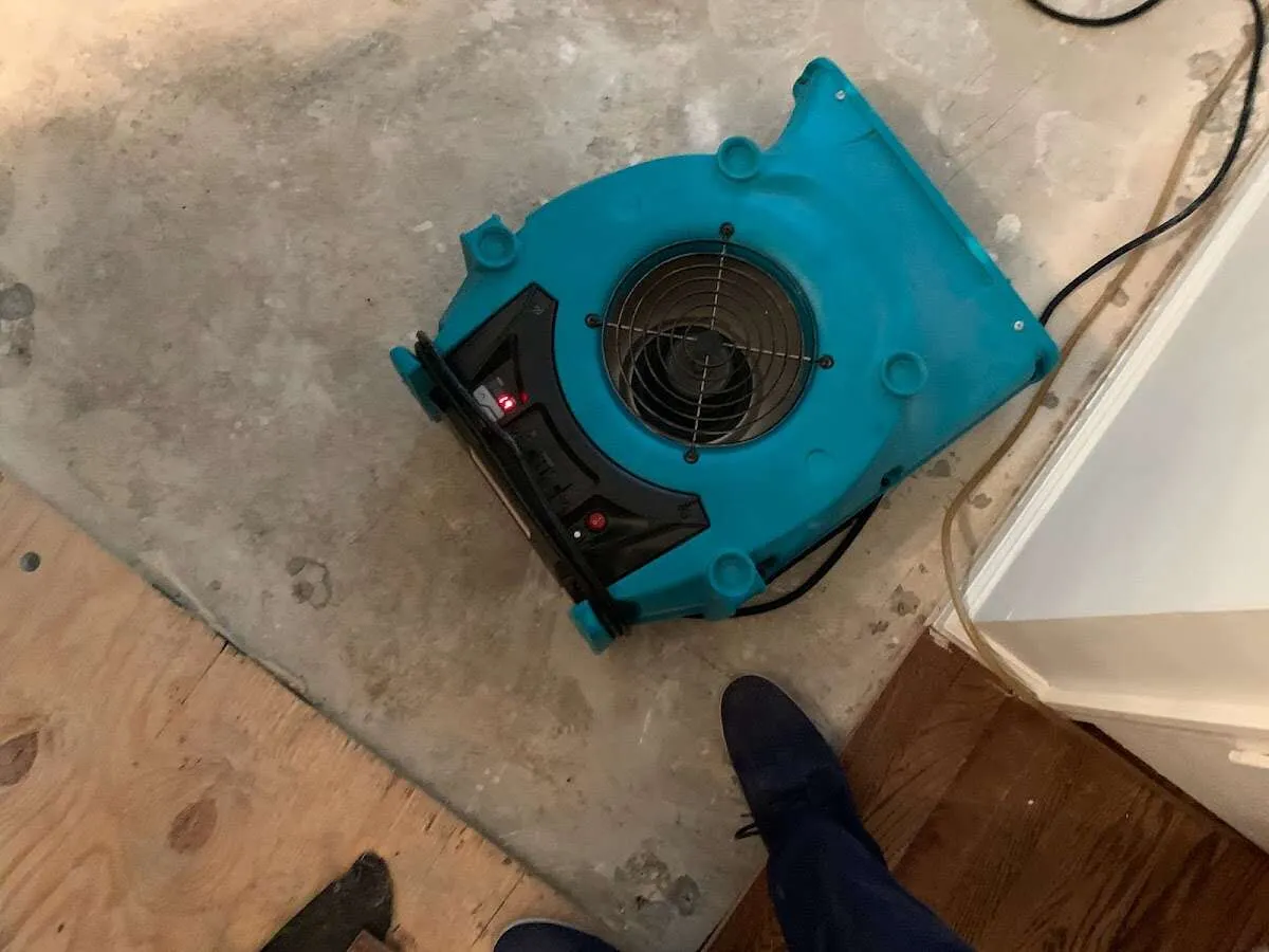 Air mover drying subfloor during Commercial Water Damage Restoration in Immokalee